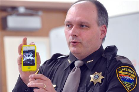 Lake County Undersheriff Dan Yonkin gives an example of how a screenshot function can save images from an app called Snapchat that usually destroys the photos after a few seconds. 
