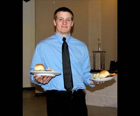 Mission Valley Mariner Alex Killian serves guests at the dinner.