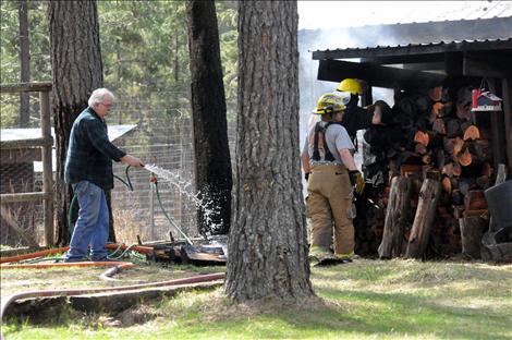 Errant embers started a grass fire in Ronan on Monday, causing a 40-gallon propane tank to explode.