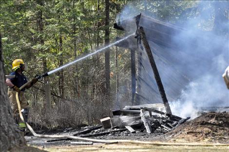 Errant embers started a grass fire in Ronan on Monday, causing a 40-gallon propane tank to explode.