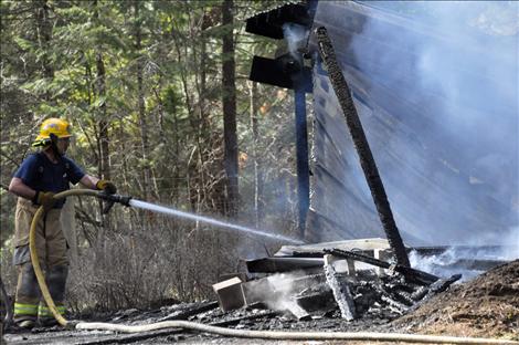 Errant embers started a grass fire in Ronan on Monday, causing a 40-gallon propane tank to explode.