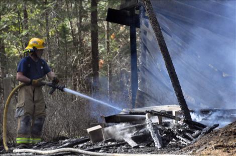 Errant embers started a grass fire in Ronan on Monday, causing a 40-gallon propane tank to explode.