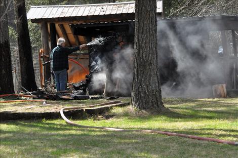 Errant embers started a grass fire in Ronan on Monday, causing a 40-gallon propane tank to explode.