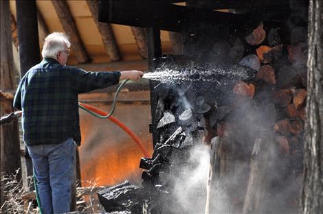 Errant embers started a grass fire in Ronan on Monday, causing a 40-gallon propane tank to explode.