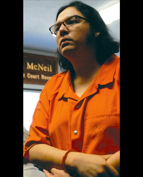 Melvin Madplume, Jr., stands to hear his sentence of life without parole.
