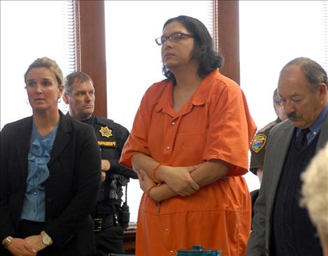 Melvin Madplume, Jr., stands to hear his sentence of life without parole.