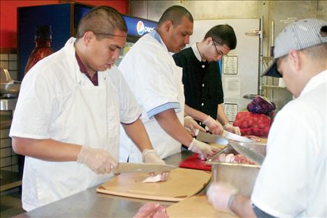 Students at Kicking Horse Job Corps learn how to make sausage.