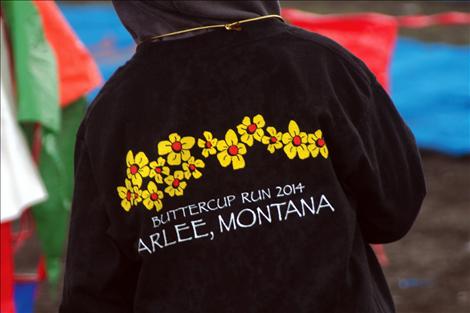 The race's namesake flower graces the back of the 2014 Buttercup Run t-shirt.