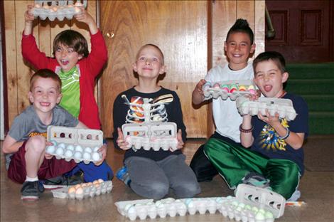 St. Ignatius Cub Scouts color dozens of eggs for children to collect during the annual egg hunt. Scouts, from left, include Harlon Leishman, Dylon Schock, Billy Long, David Michell and Landry Leishman.