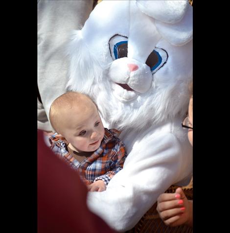 A baby cuddles with the Easter Bunny in Ronan's Bockman Park.