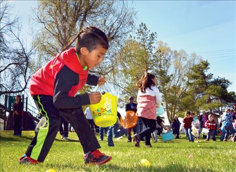 Jaidon Mahkuk, 6, scrambles for eggs in Ronan.