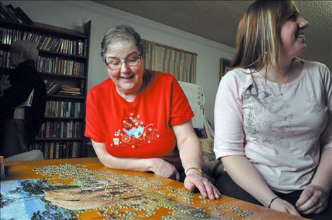 Linda Schoon works her way through a puzzle at the Ronan Senior Citizen’s Center with Andrea Lohf, the new director to fill Schoon's shoes.