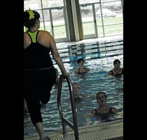 Gina VanVoorhies demonstrates a move for arthritis instructors at the Mission Valley Aquatic Center.  