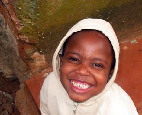 Watutuwa is all smiles as he waits for Jack Stivers to take his photo.