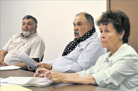 Tim Orr, Jerry Laskody, and Carol Lyons listen to the concerns of constitutents of the Mission Irrigation District. 