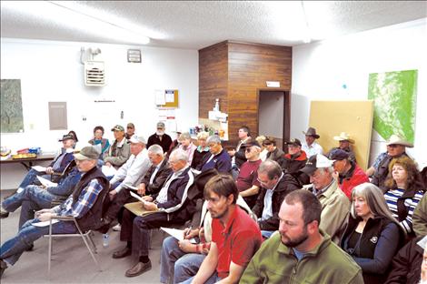 A crowd listens to the Mission and Flathead irrigation districts’ commissioners at a Monday press conference. The conference informed irrigators about future joint plans of the two districts, including the commissioners’ stance on the proposed Confederated Salish and Kootenai Tribes’ Water Compact. 