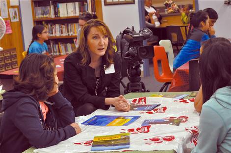 KPAX anchor Jill Valley shows her camera and answers questions about being a broadcaster. 