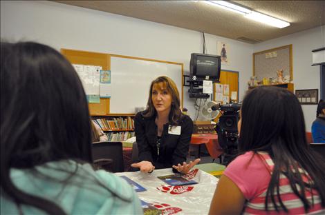 KPAX anchor Jill Valley shows her camera and answers questions about being a broadcaster. 