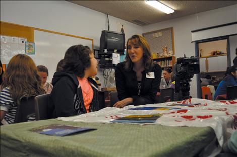 KPAX anchor Jill Valley shows her camera and answers questions about being a broadcaster. 