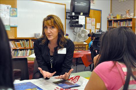 KPAX anchor Jill Valley shows her camera and answers questions about being a broadcaster. 