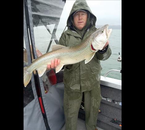 Todd Morigeau of Polson stands with a lake trout caught during Spring Mack Days.