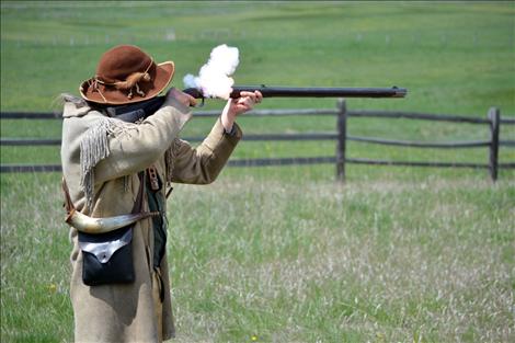 Kim Koenig demonstrate his black powder rifle.