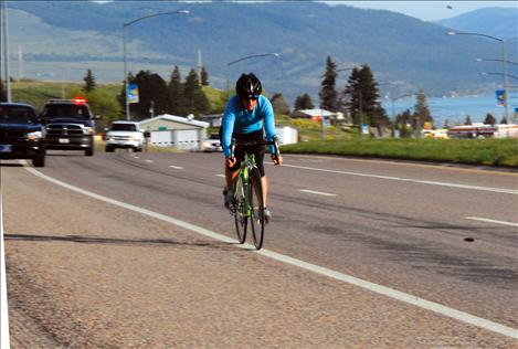 Ali Bronsdon heads up Polson Hill to bring awareness to the Special Olympics Torch Run.