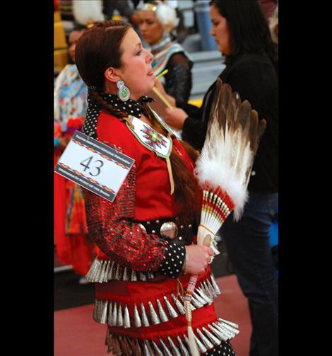 Dancer Naomi Billedeaux-Myers waits for the grand entry line up at the SKC powwow.