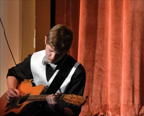 Carson Jones performs a guitar solo.