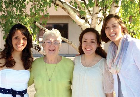 Two Polson High School seniors are the recipients of two $1,000 Ken Rohrenbach Scholarships. From left are Monica Cleveland, Blanche Rohrenbach, Alisha Jore, and Job Service Employers’ Committee Chair Whitney Cantlon. 