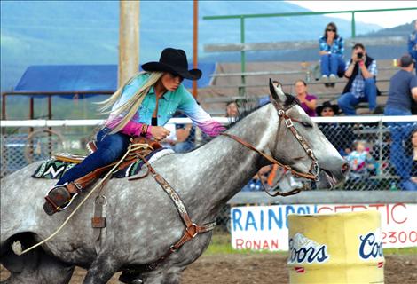 s her gray horse towards home at the Spur the Cancer out of Montana Rough Stock Rodeo in Arlee.