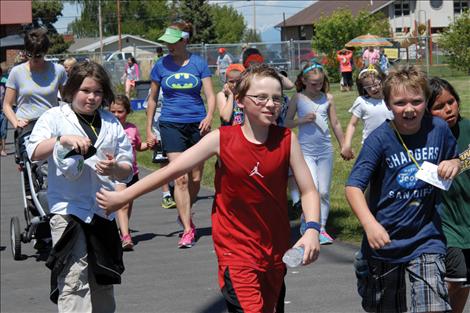 Linderman kids hit the track to raise money for the exercise and to raise money for new playground equipment