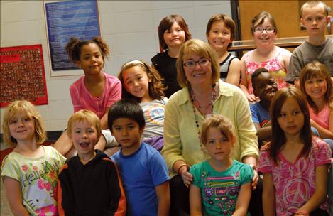 Cherry Valley Elementary School Principal Elaine Meeks and a group of her announcers have fun. 