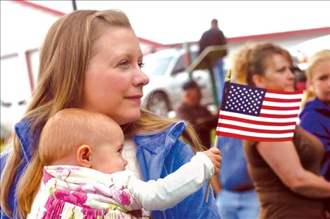 Erika Mitchell and her daughter, Abrianna, attend the Memorial Day parade in Ronan.