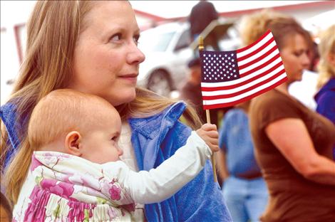 Erika Mitchell and her daughter, Abrianna, attend the Memorial Day parade in Ronan.