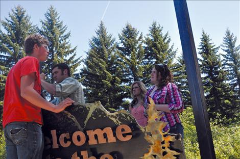 The Cantlon Family Youth Home receives a new sign made by vocational-ag students at Ronan High School. 