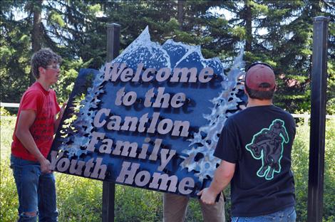 The Cantlon Family Youth Home receives a new sign made by vocational-ag students at Ronan High School. 