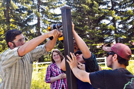 The Cantlon Family Youth Home receives a new sign made by vocational-ag students at Ronan High School. 