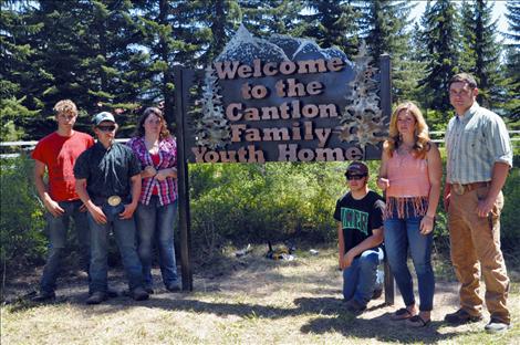 The Cantlon Family Youth Home receives a new sign made by vocational-ag students at Ronan High School. 