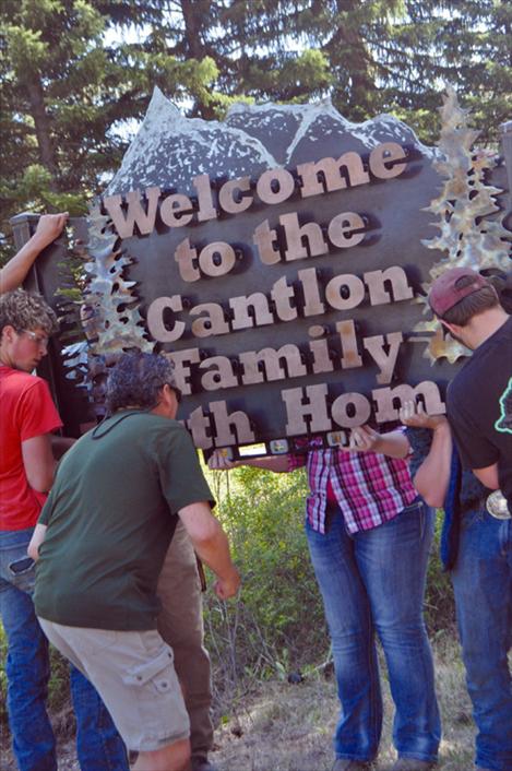 The Cantlon Family Youth Home receives a new sign made by vocational-ag students at Ronan High School. 
