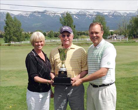 Senior golfers help raise $1,784 for the local Boys and Girls Club May 17-18 at Polson Bay Golf Course. Participants include, from left, Donna Bussi, women’s champion; Tracy Dooley, Farmers Insurance agent and tournament chairman; and Craig Hurlbert, men’s champion.