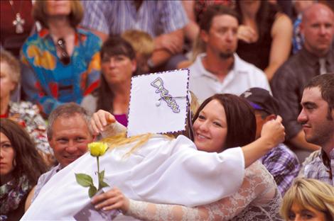 Charlo graduate Lilly Jensen gets a congratulatory hug. 