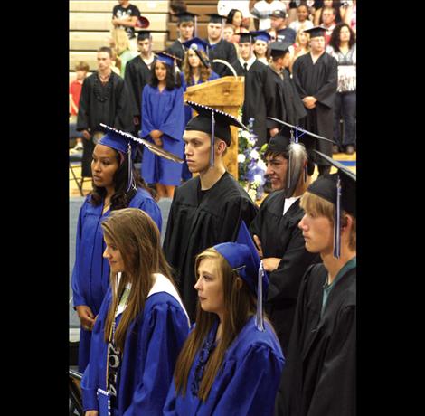 Students listen as recording artist Tim Ryan Roullier tells graduates that coming from a small school gives them an edge.