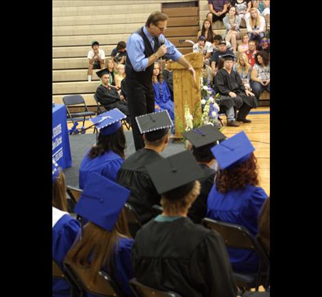 Students listen as recording artist Tim Ryan Roullier tells graduates that coming from a small school gives them an edge.