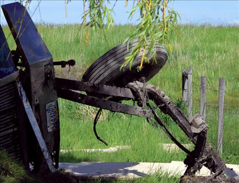 A load of Plum Creek lumber was scattered after the rig hauling it ended on its side off Highway 93 near Dayton June 3.