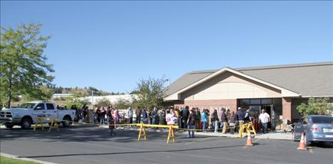 Customers line up at Eagle Bank in Polson on Wednesday, Sept. 12, when enrolled members of the Confederated Salish and Kootenai Tribes received $10,000 each as part of a settlement between the federal government and the tribes.