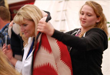 Nursing students are blanketed upon graduation.