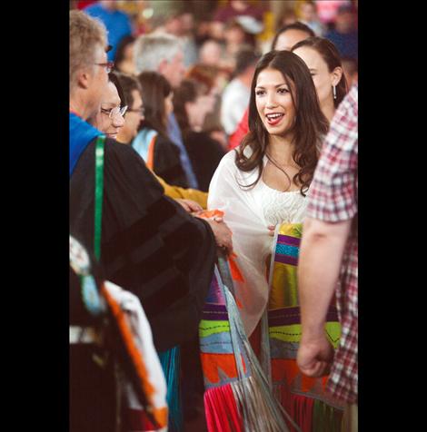 Graduates greet SKC faculty during the graduation ceremony.