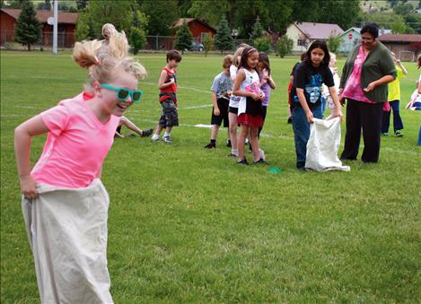 Linderman students compete in a sackrace during field day.