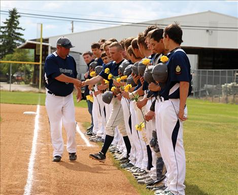 Mission Valley Mariners each have a yellow rose to offer to Kellen Hoyt, who pitched his last game June 10 before being deployed to Afghanistan June 13 with the Army National Guard.